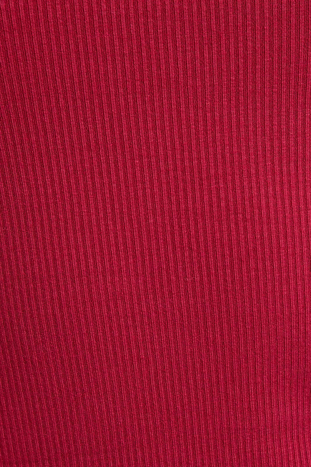 Close-up of red fabric with a ribbed texture