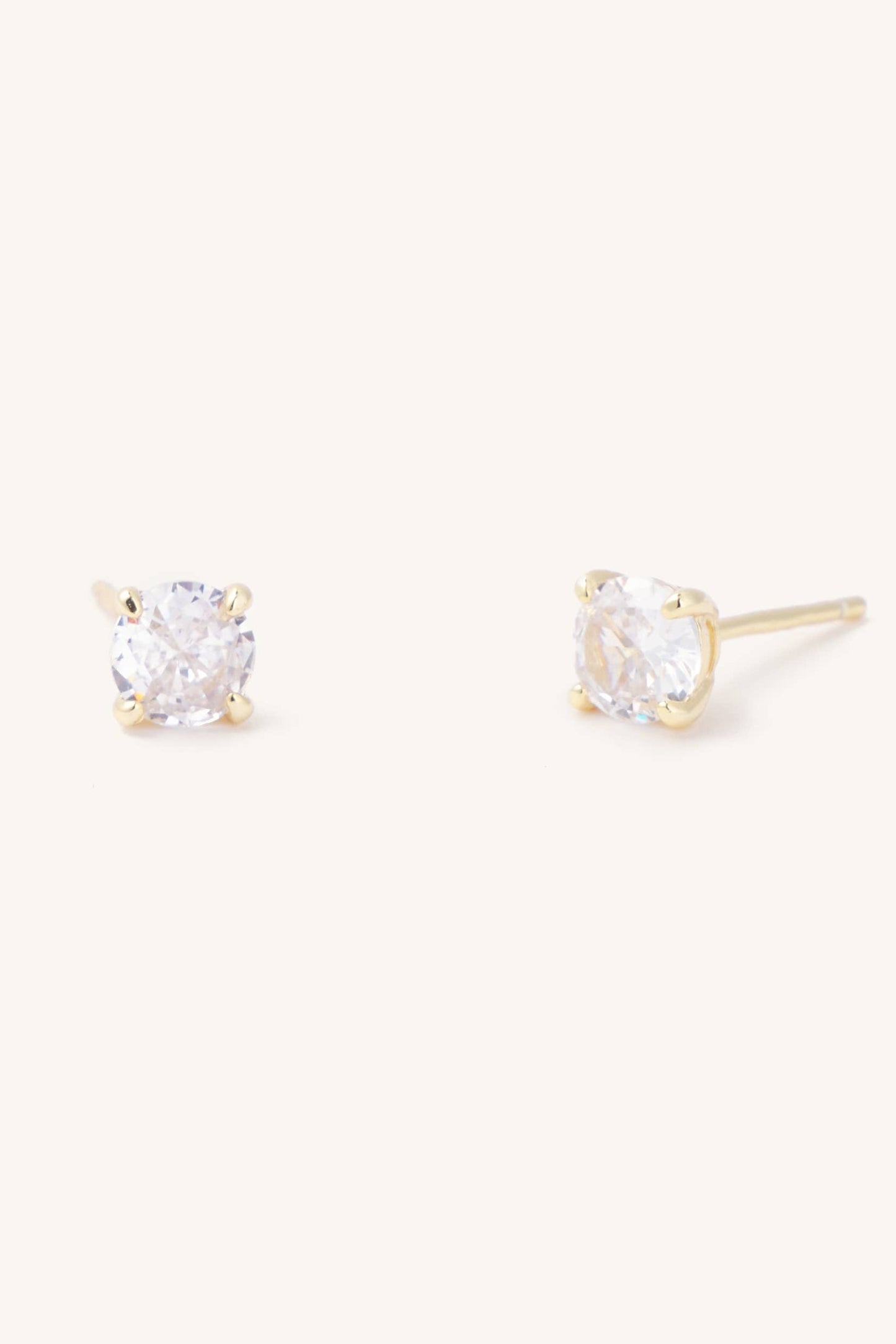 A pair of gold-plated sterling silver stud earrings with round cut cubic zirconia gems