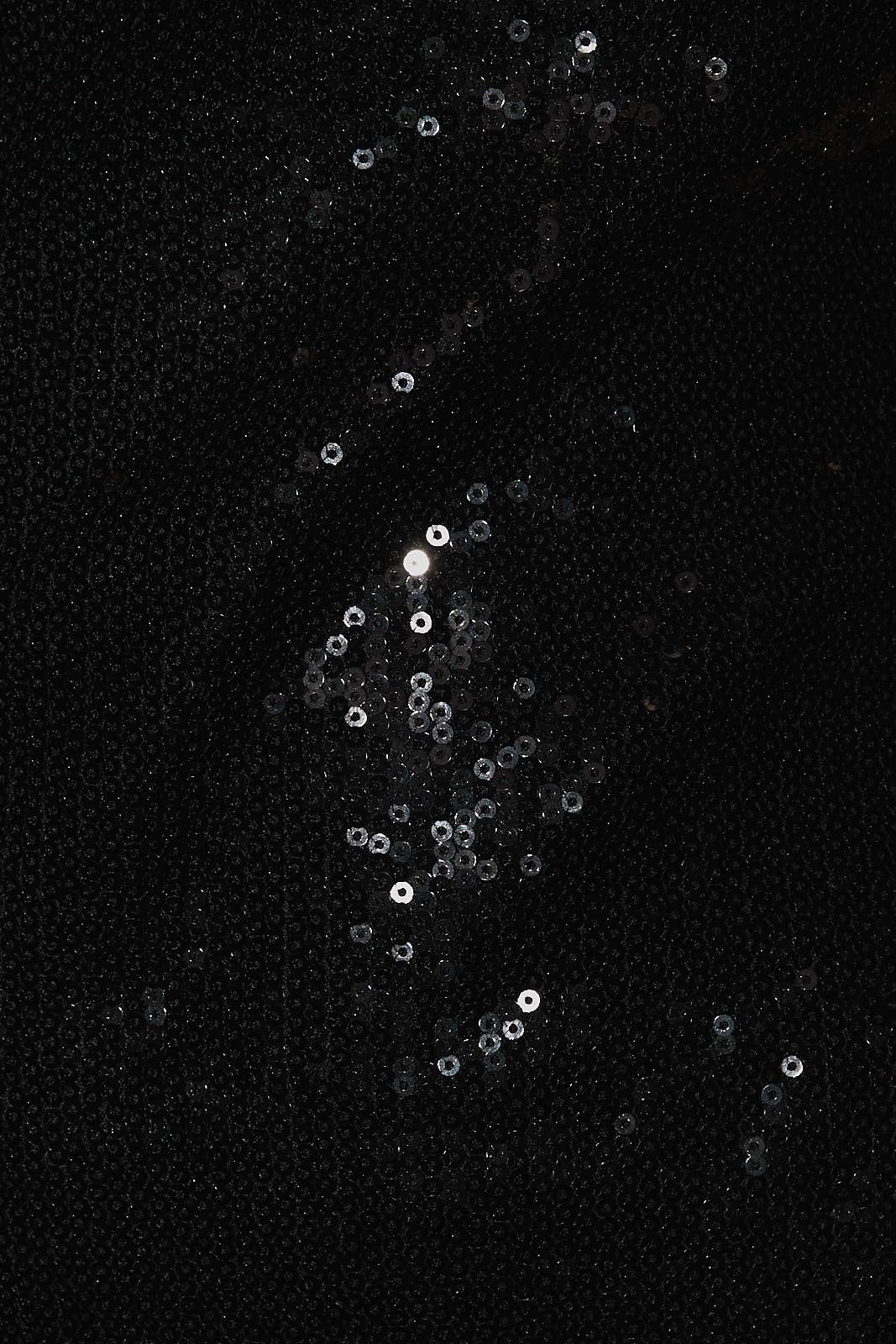 close up of black sequin dress
