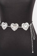 A silver heart-patterned waist chain displayed on a black mannequin torso against a white background.