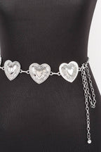 A silver heart-patterned waist chain displayed on a black mannequin torso against a white background.
