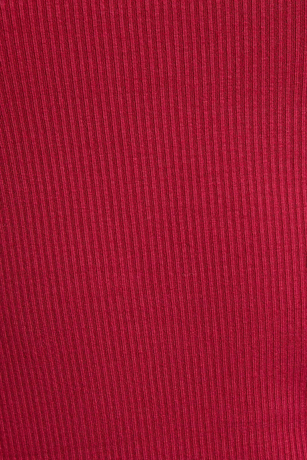 Close-up of red fabric with a ribbed texture