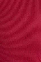 Close-up of red fabric with a ribbed texture