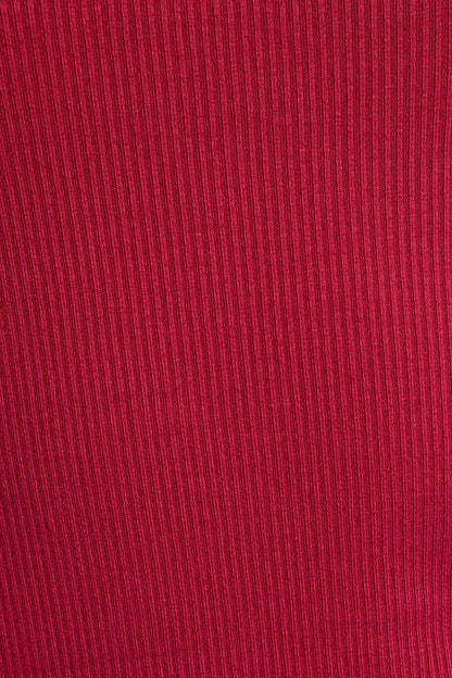 Close-up of red fabric with a ribbed texture