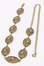 An antique-style gold-toned necklace featuring seven oval links, each inlaid with a small turquoise bird motif, displayed on a clean white background.
