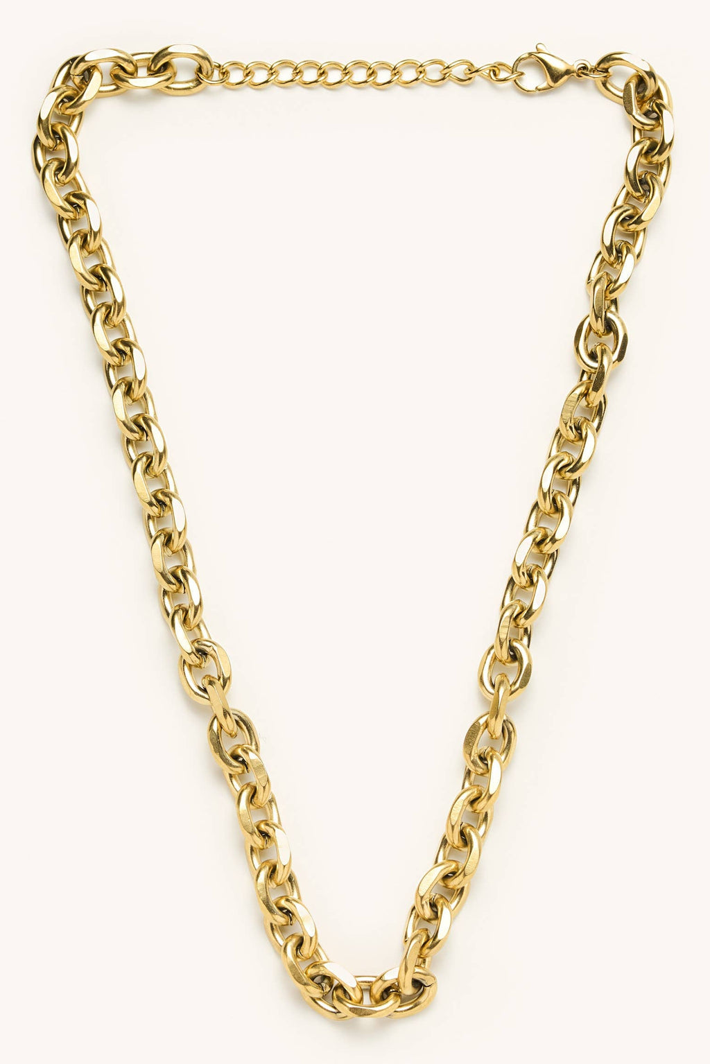 Gold chain necklace on a white background