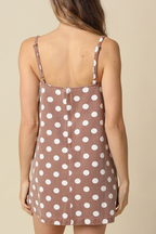 Woman wearing a polka dot dress on a website product page