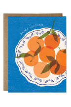 Card with illustration of oranges on a blue background