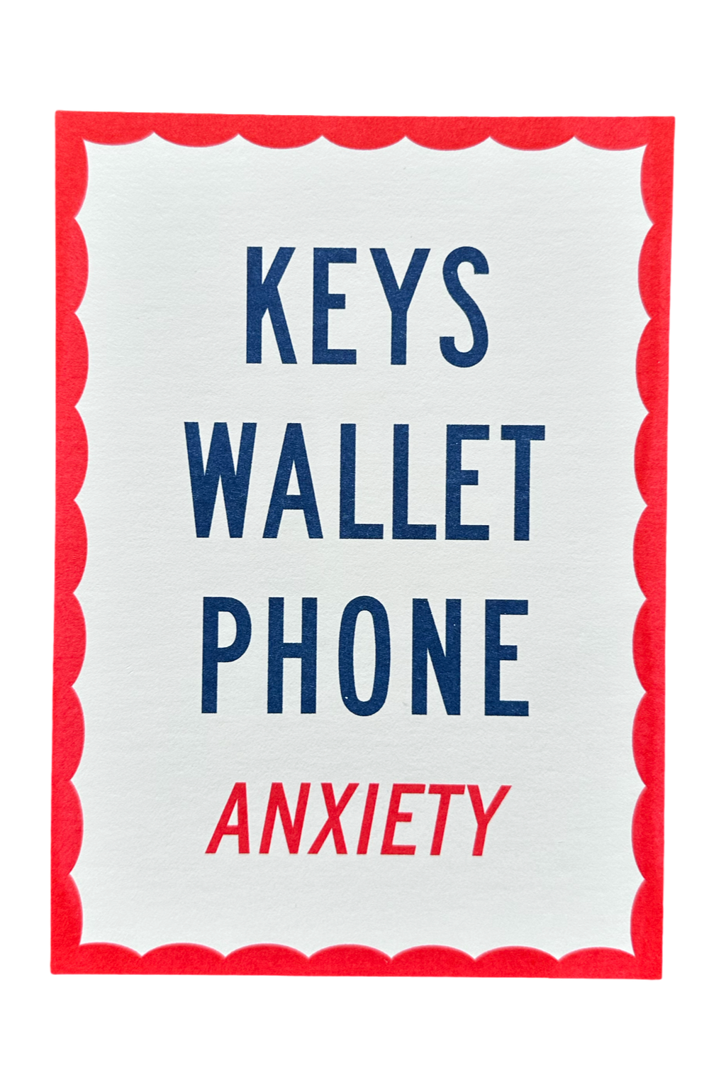 A square white card or sign with a red scalloped border, featuring the words 'KEYS WALLET PHONE' in dark blue and 'ANXIETY' in red, centered on a light gray background.