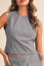 Woman wearing a striped top on a beige background