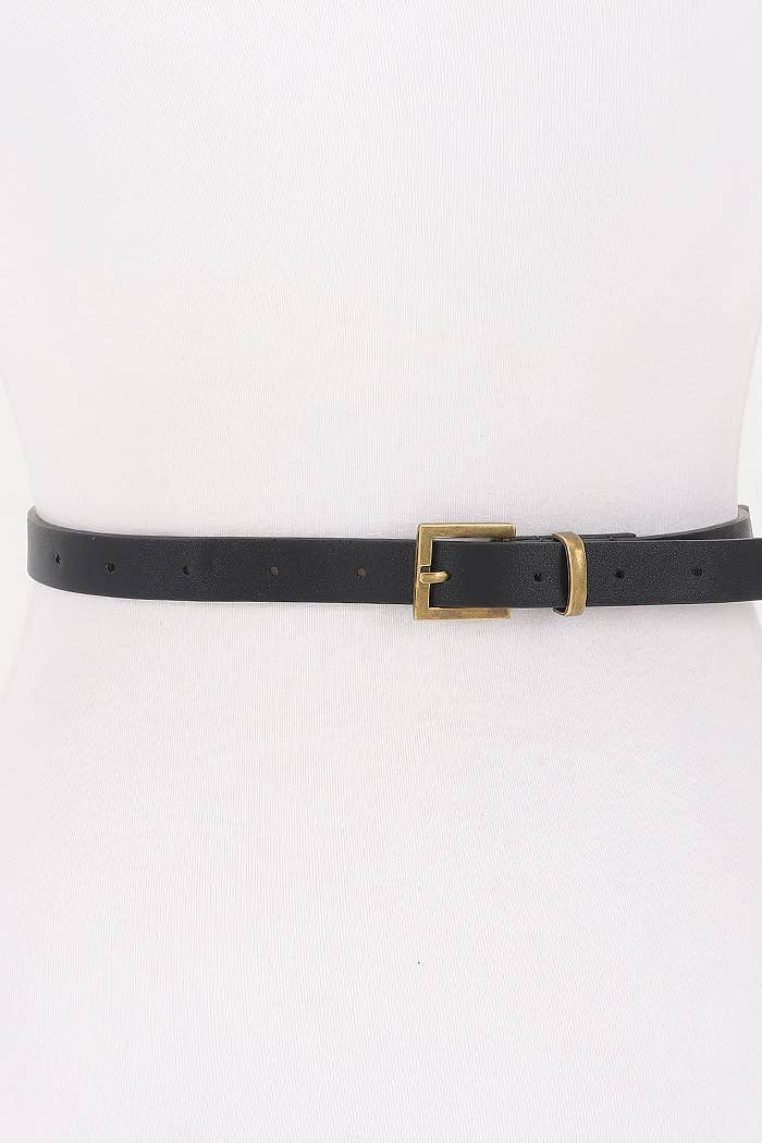 Black belt with a gold buckle on a white background