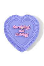 heart cake candle - surviving, not thriving