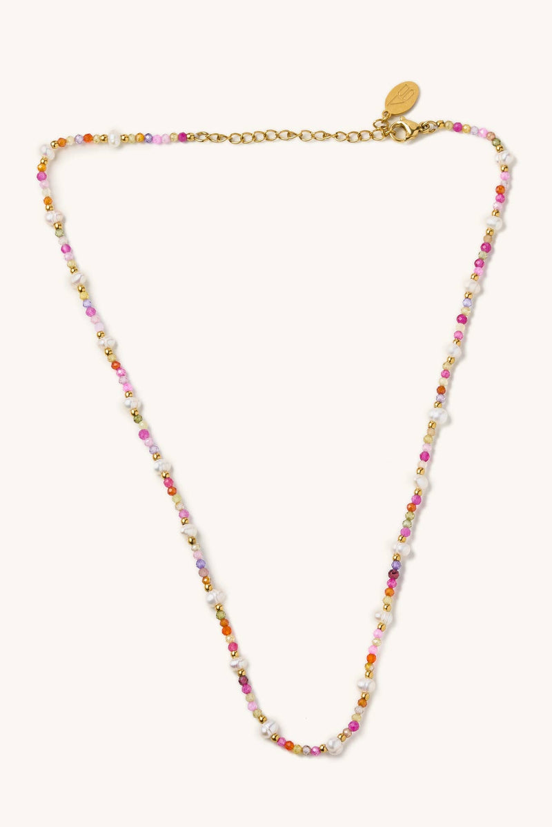 Multicolored beaded necklace on a white background