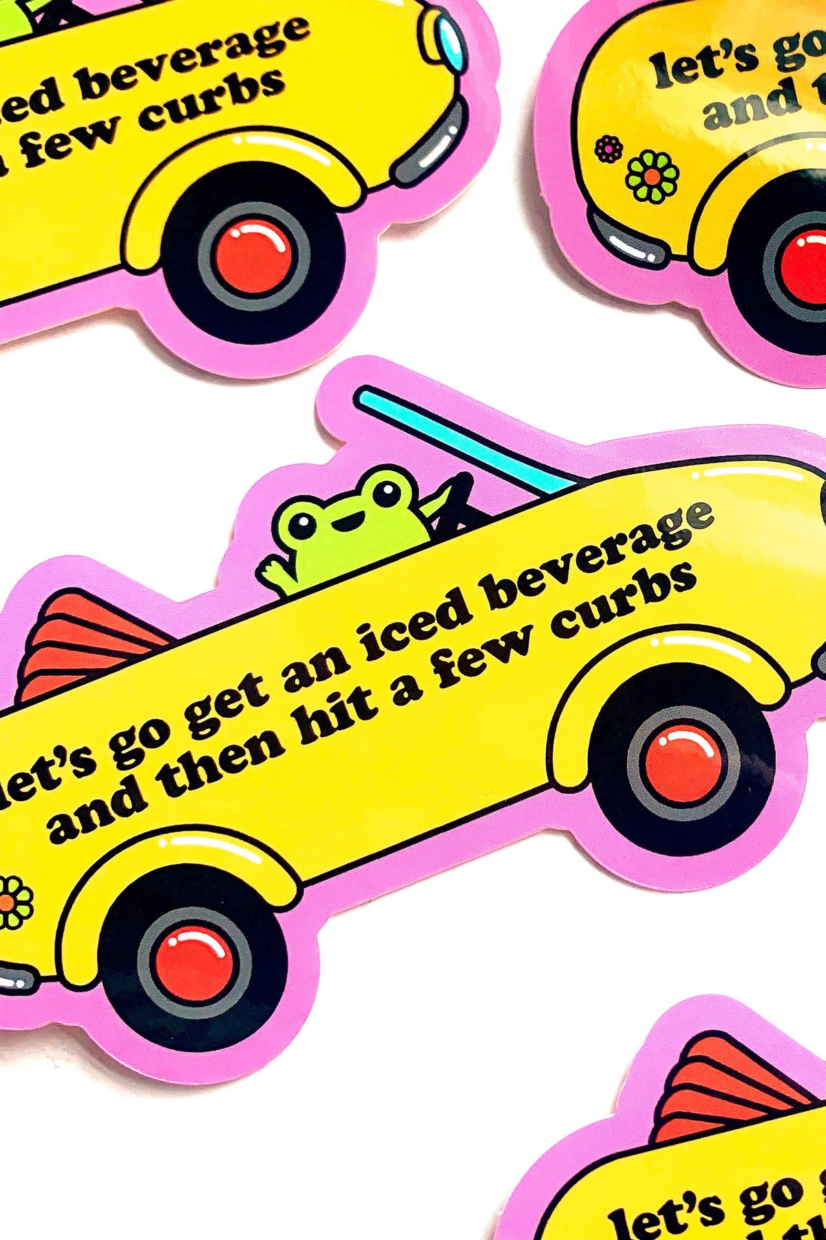 Stickers with yellow cars and frogs, featuring text on a white background
