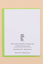 White card with black text on a beige background