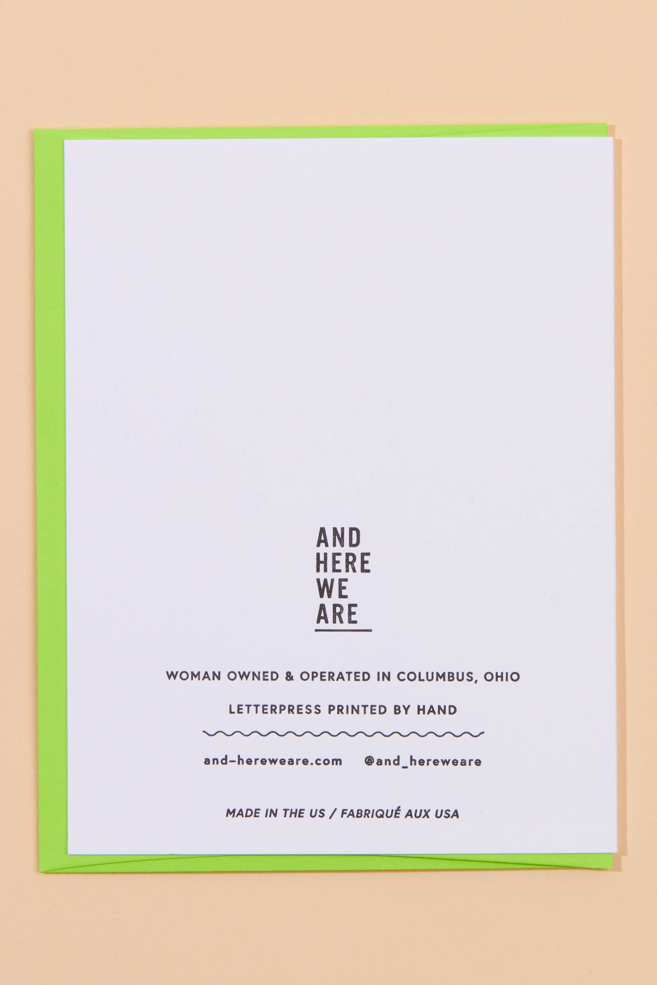 White card with black text on a beige background