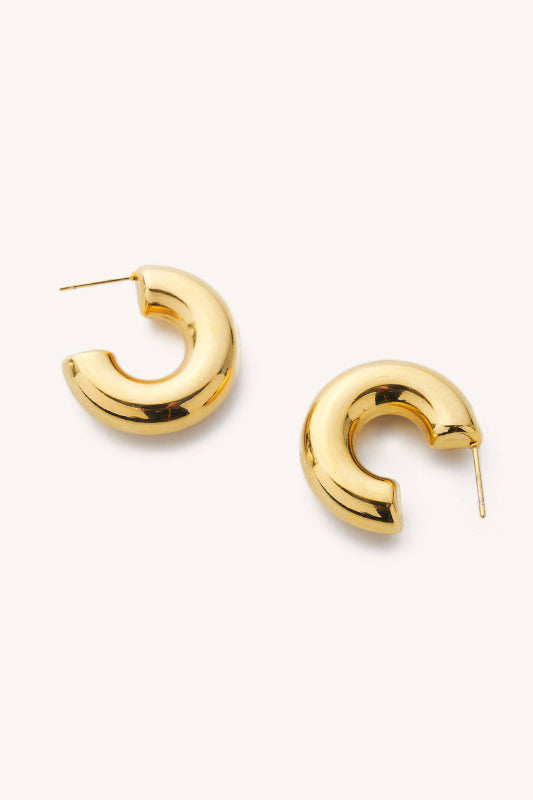 Gold hoop earrings on a white background