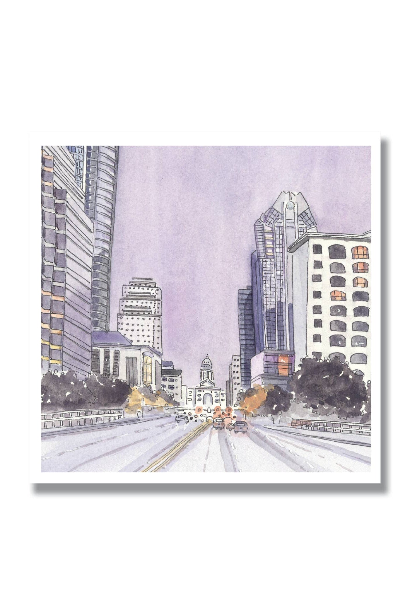 A watercolor-style cityscape print showing tall buildings, a wide road with cars, and a domed government building in the distance under a pale lavender sky, presented on a white background with a drop shadow.