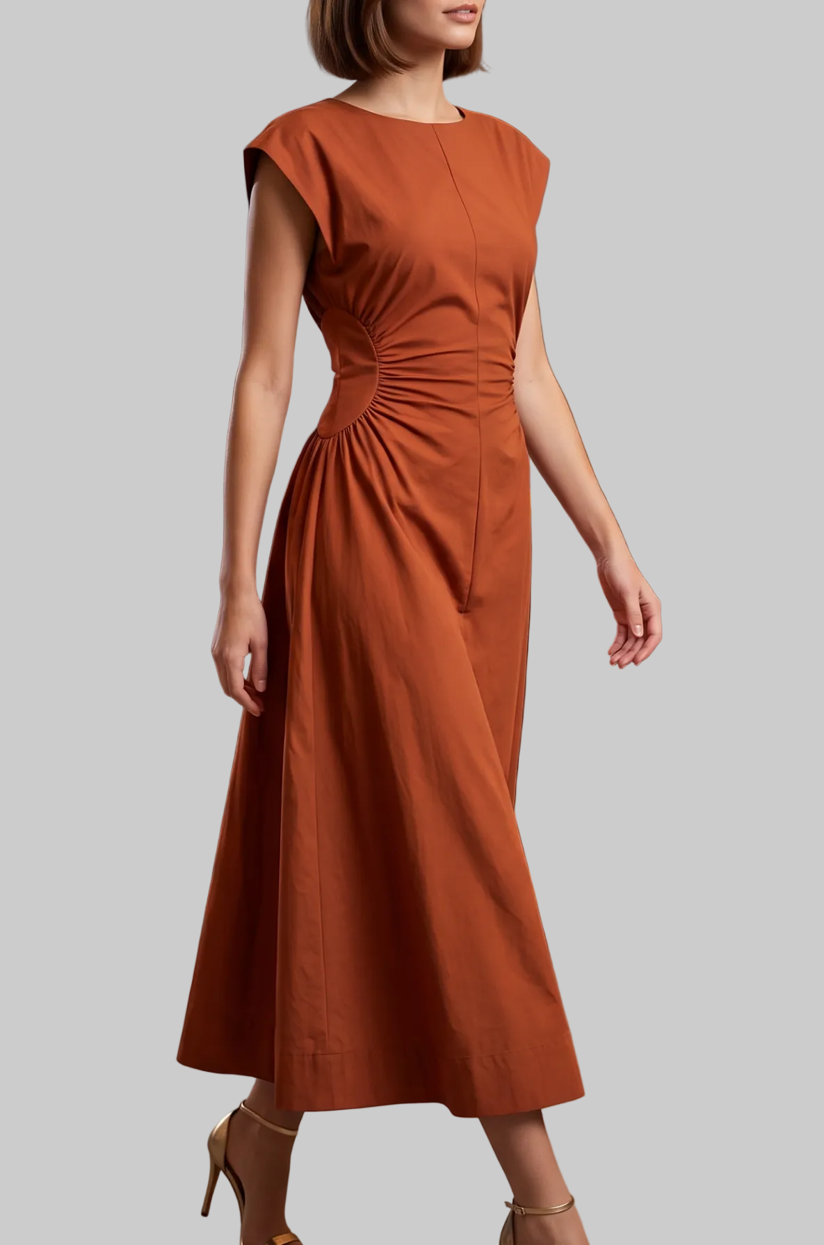 A woman wearing a rust-orange midi dress with cap sleeves and a gathered waist walks through a modern bar and event space. The dress has a warm terracotta color and is paired with beige high-heeled sandals.