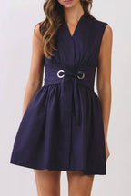 Woman wearing a navy blue dress on a white background
