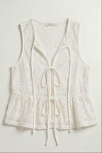 White lace sleeveless top on a light gray background
