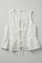 White lace sleeveless top on a gray background