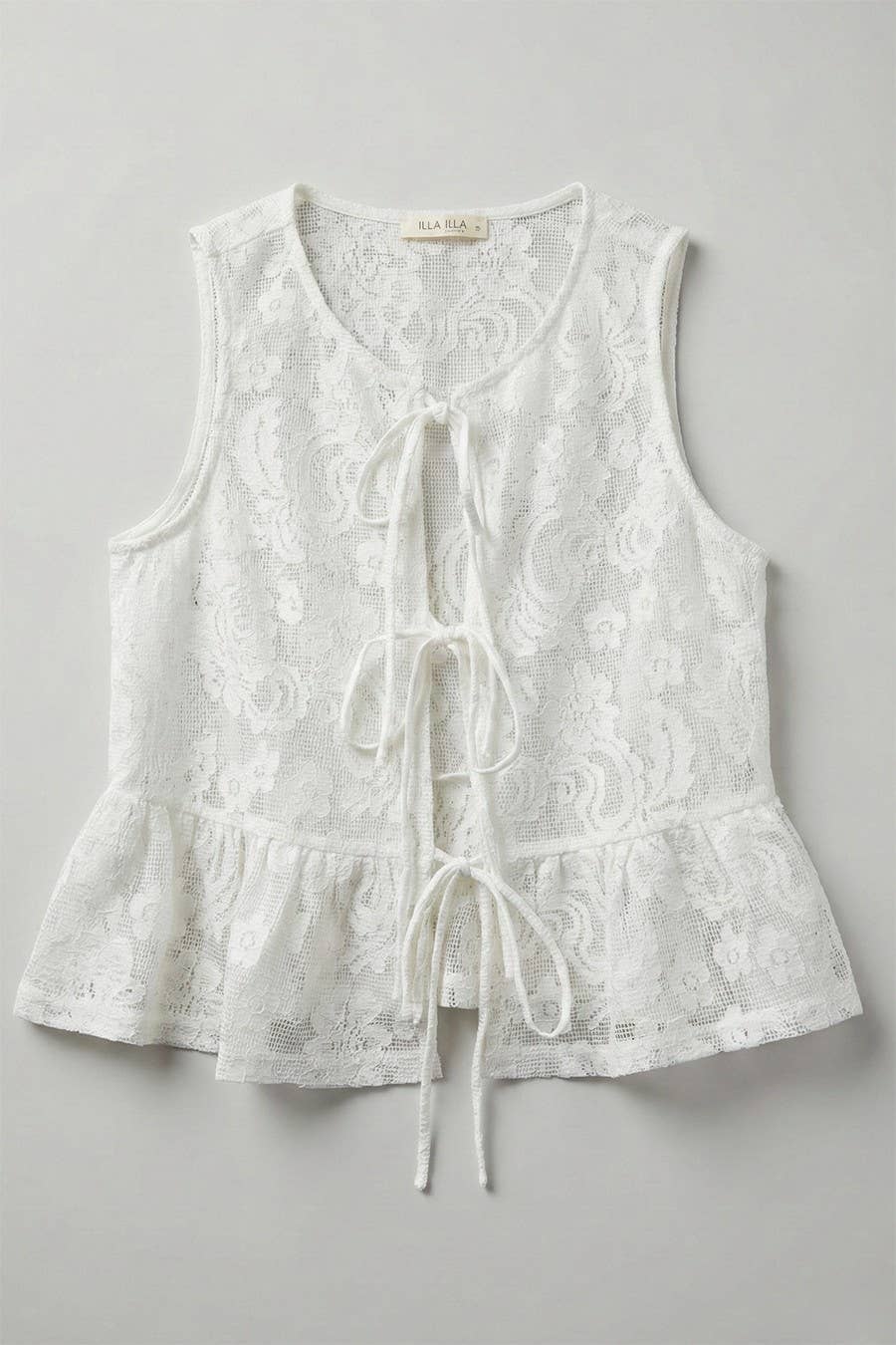White lace sleeveless top on a gray background