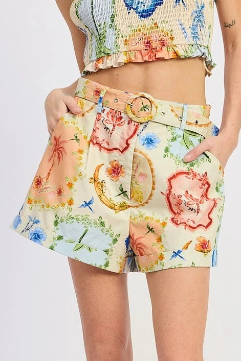 Woman wearing a colorful floral outfit on a white background