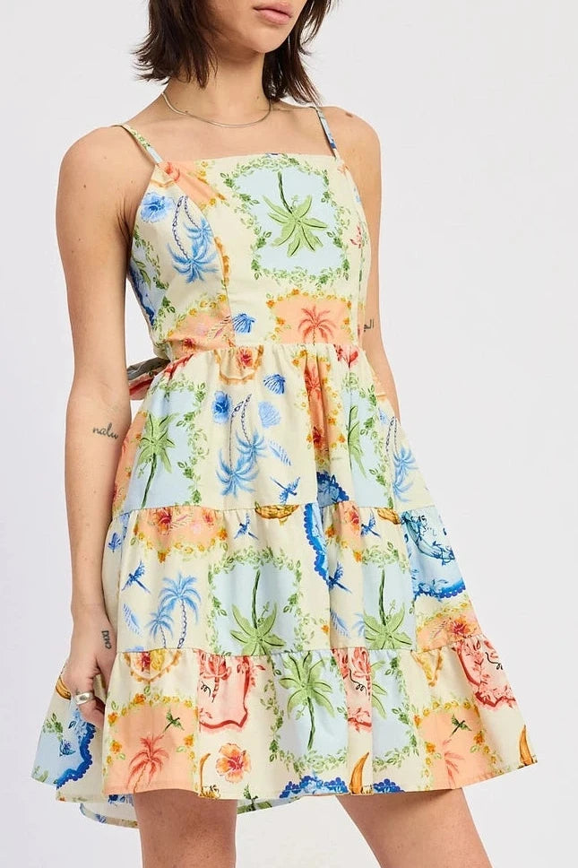 Woman wearing a colorful floral dress on a white background