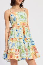 Woman wearing a colorful floral dress on a white background