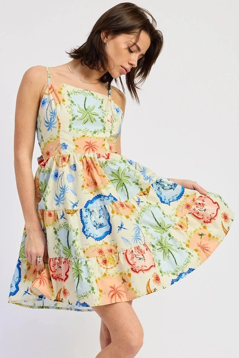 Woman wearing a colorful floral dress on a white background