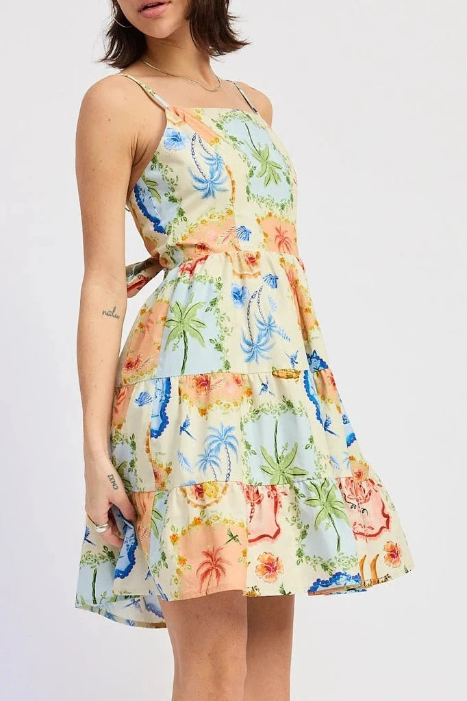 Woman wearing a colorful floral dress on a white background
