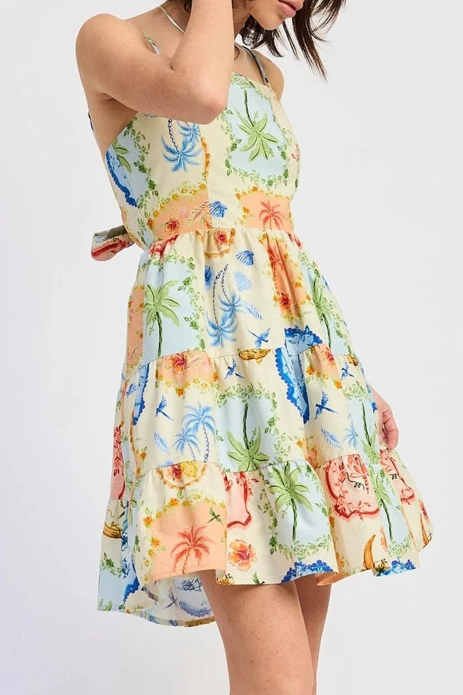 Woman wearing a colorful floral dress on a white background