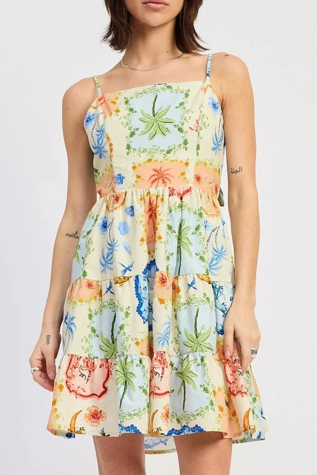 Woman wearing a colorful floral dress on a white background