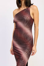 A woman wearing a one-shoulder bodycon dress with an abstract wavy pattern in deep burgundy, plum, and mauve tones, photographed against a plain light gray studio background.