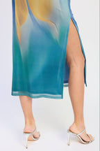 Teal sheer dress with a slit on a white background