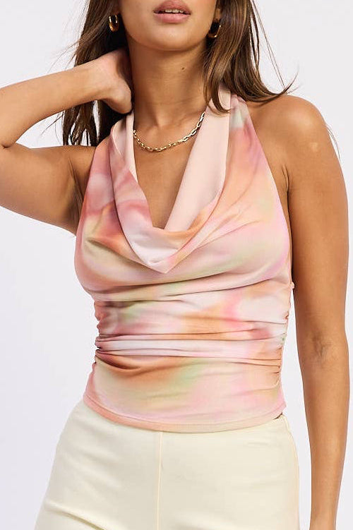 Woman wearing a sleeveless top and shorts on a white background