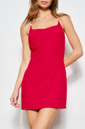 Woman wearing a red dress against a white background