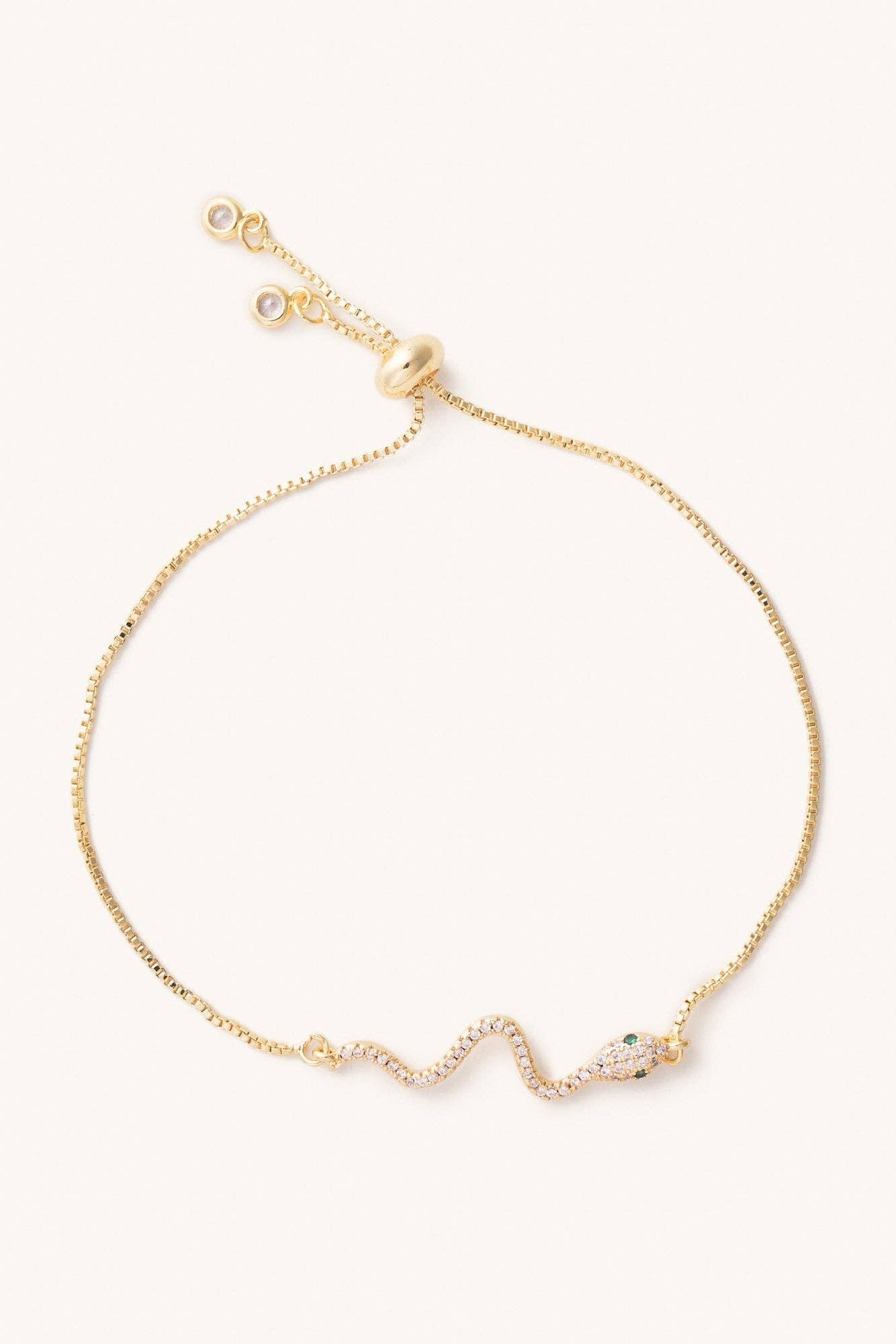Gold bracelet with snake on a white background