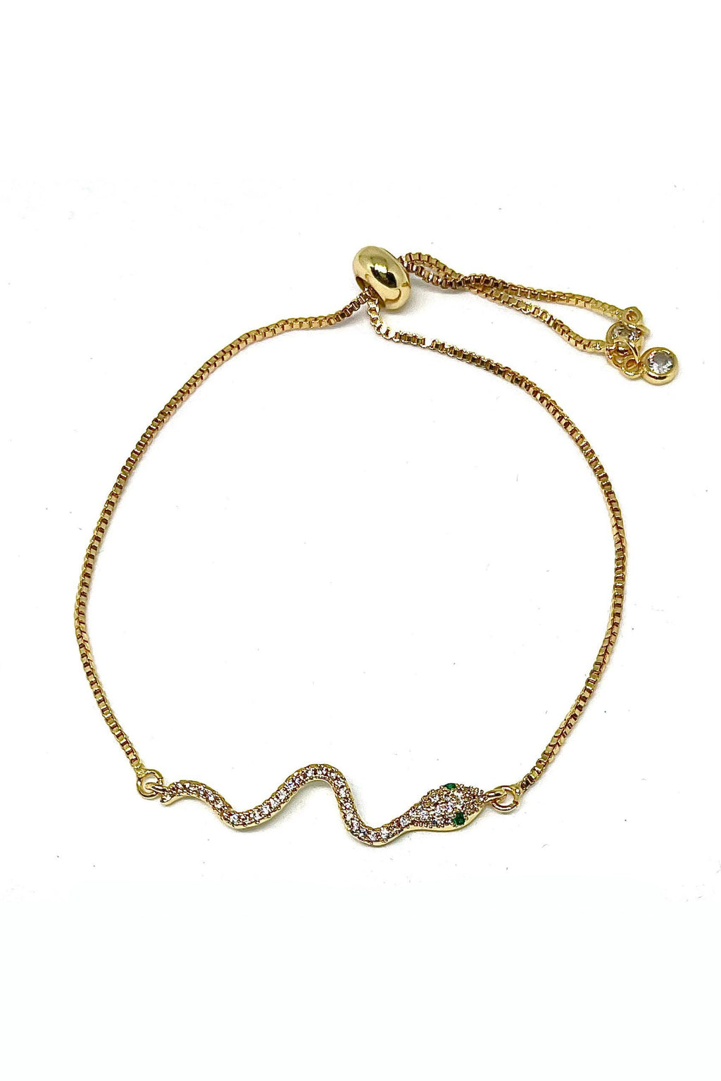 Gold bracelet with snake design on a white background
