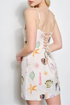 Woman wearing a floral dress with a white background