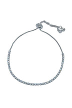 Silver bracelet with clear stones on a white background