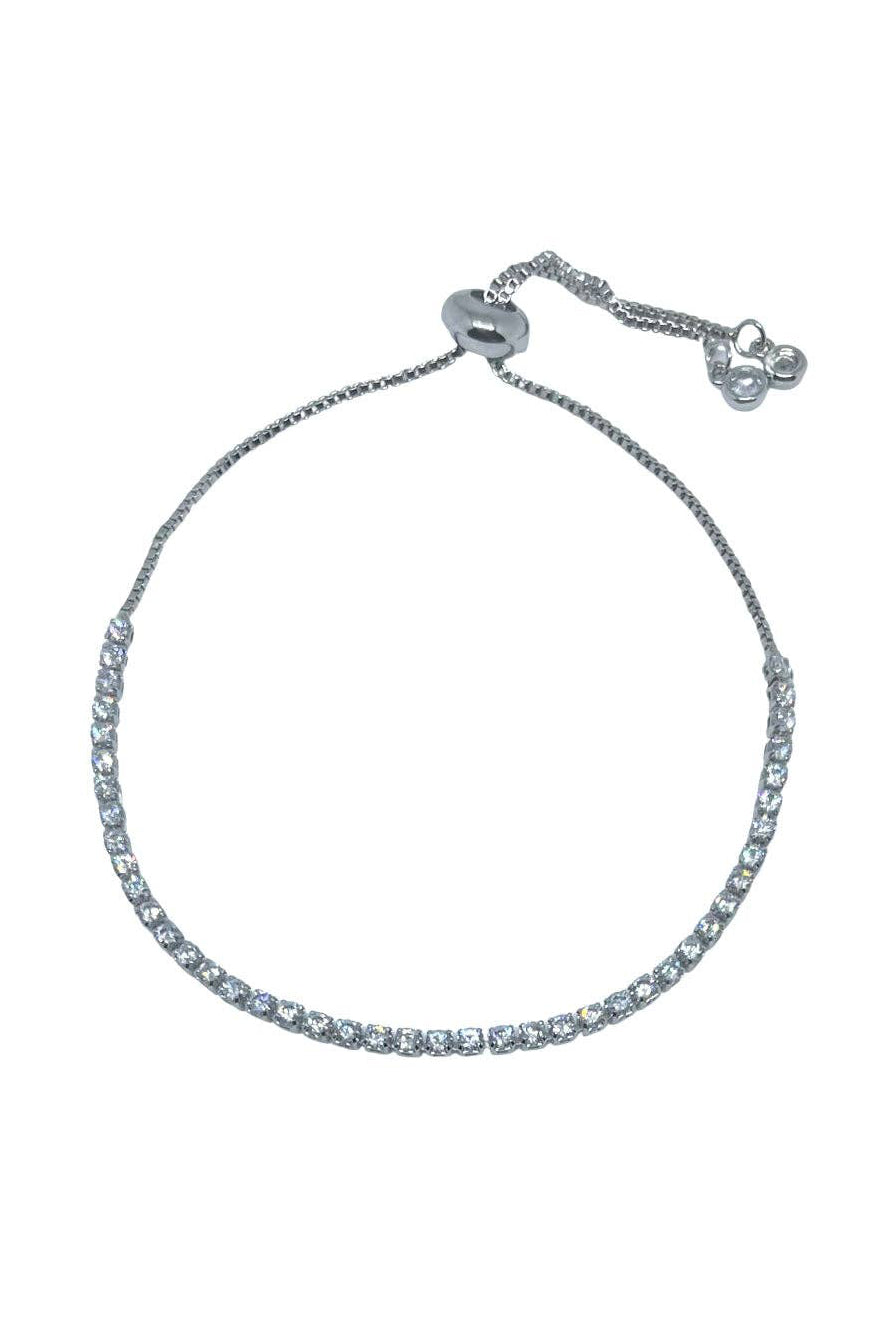 Silver bracelet with clear stones on a white background