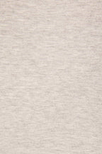 A close-up of a light heather gray fabric texture, showing the fine knit pattern and subtle gray and off-white flecks.