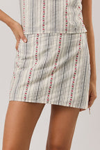Woman wearing a skort on a plain background