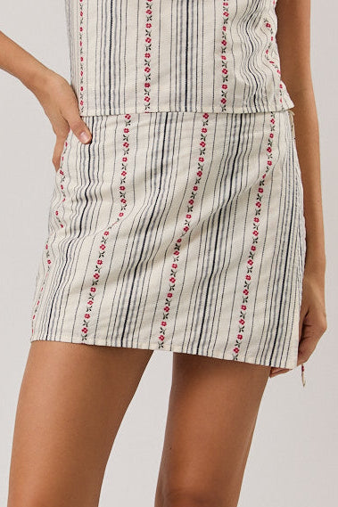 Woman wearing a skort on a plain background