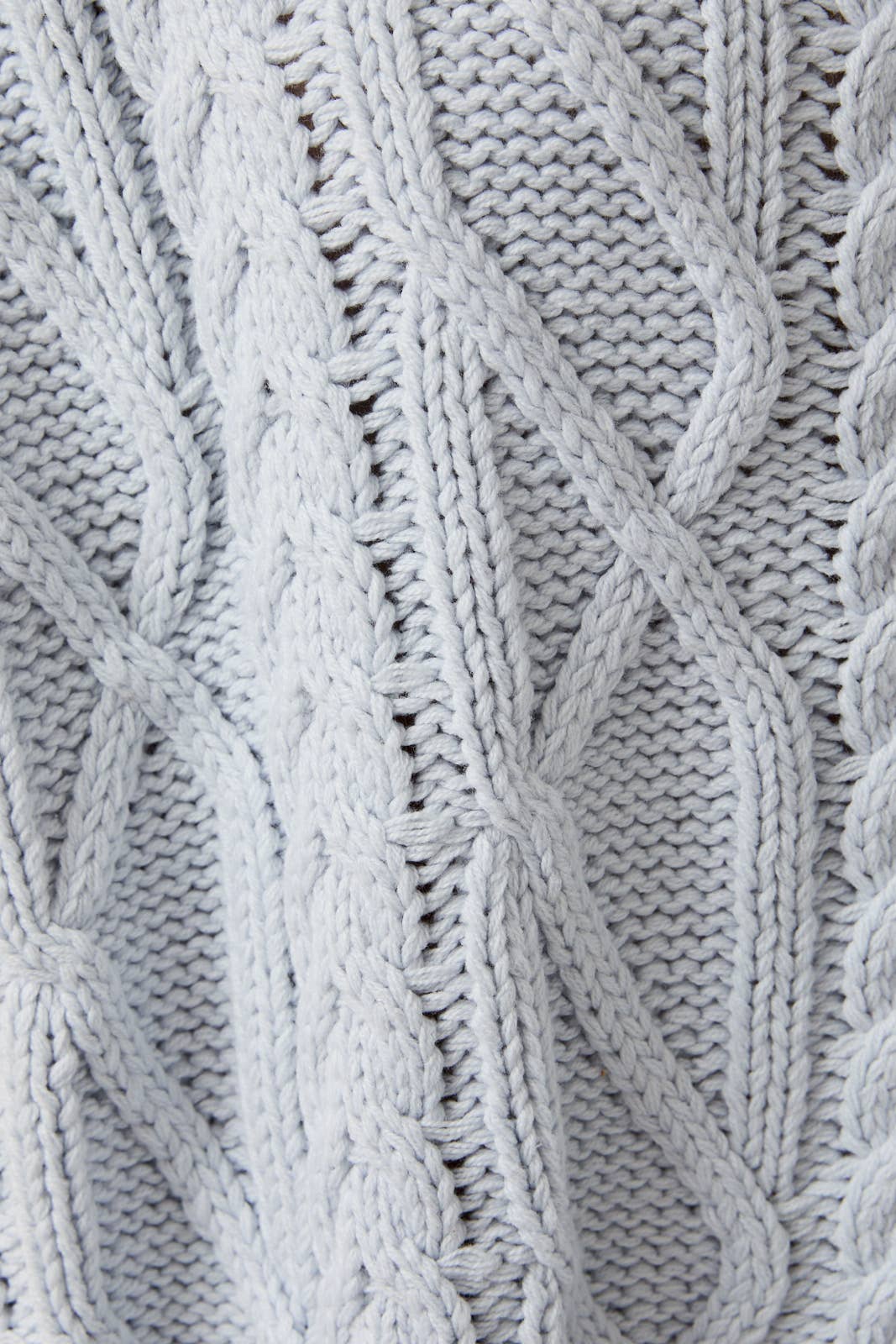 Close-up of a textured blue knitted fabric