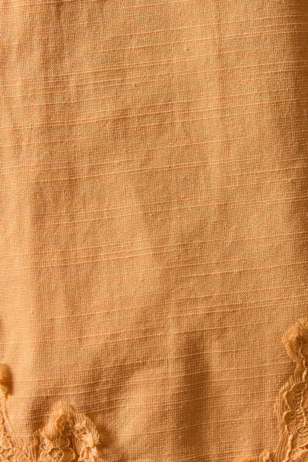 Close-up of beige fabric with textured pattern