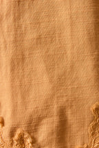 Close-up of beige fabric with textured pattern