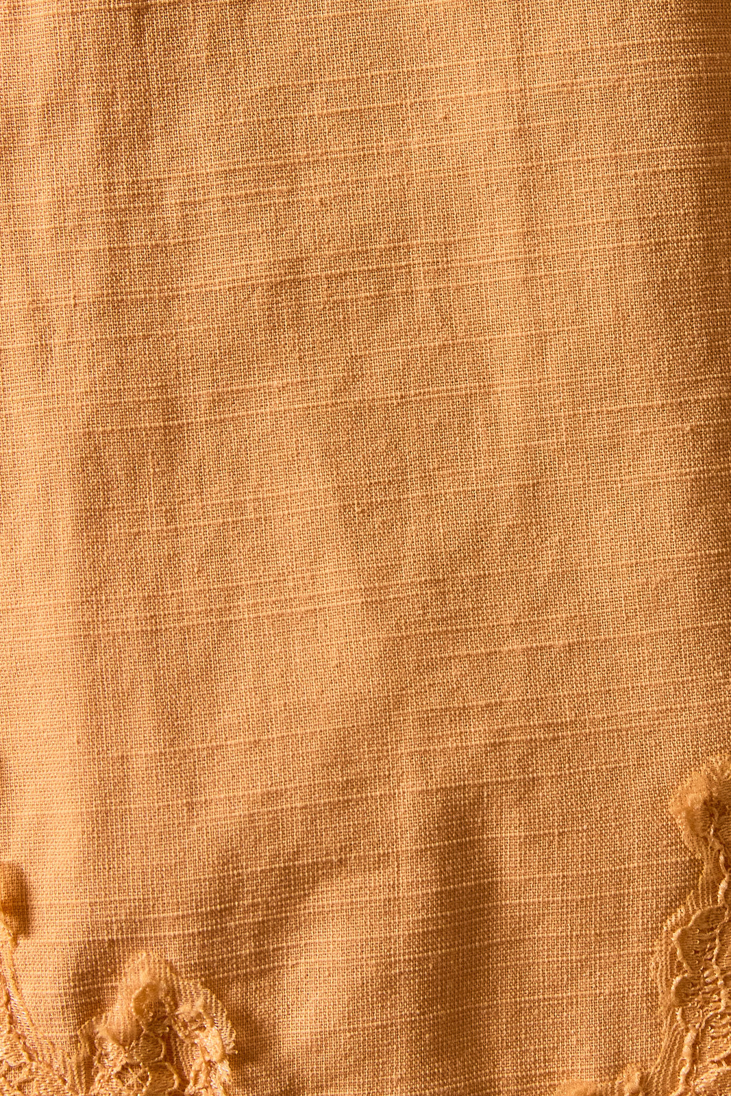 Close-up of beige fabric with textured pattern
